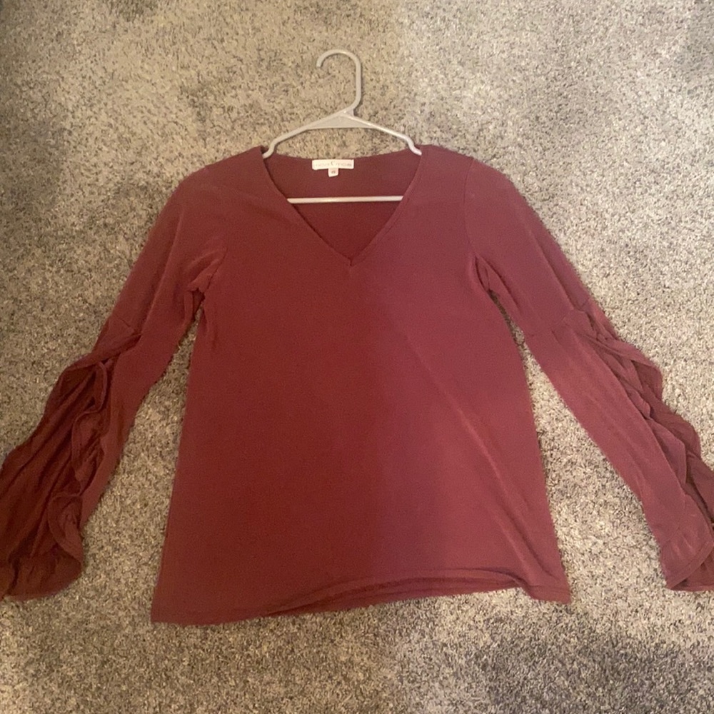 MOA MOA’s red-ish/ maroon-ish colored long sleeve top with flared sleeves